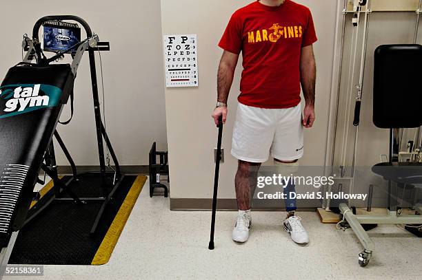 Jeff Sanders stands in the physical therapy room of Walter Reed Army Medical Center as members of the Disabled American Veterans visit wounded...