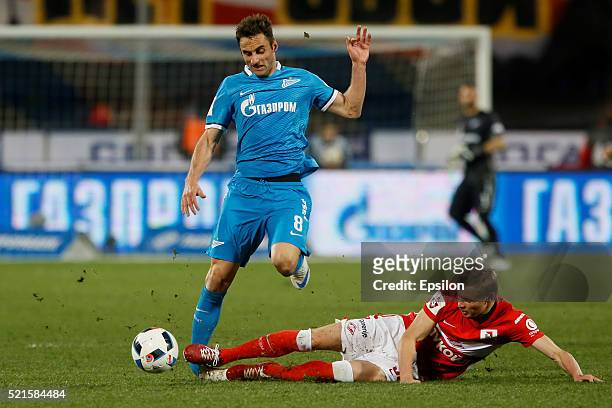 Mauricio of FC Zenit St. Petersburg and Yevgeni Makeyev of FC Spartak Moscow vie for the ball during the Russian Football League match between FC...
