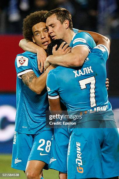 Artem Dzyuba of FC Zenit St. Petersburg celebrates his goal with Axel Witsel of FC Zenit St. Petersburg and Hulk of FC Zenit St. Petersburg during...