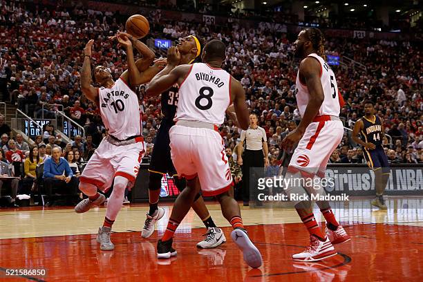 Indiana Pacers forward Myles Turner is surrounded by Raptors as Toronto Raptors guard DeMar DeRozan , Toronto Raptors center Bismack Biyombo and...