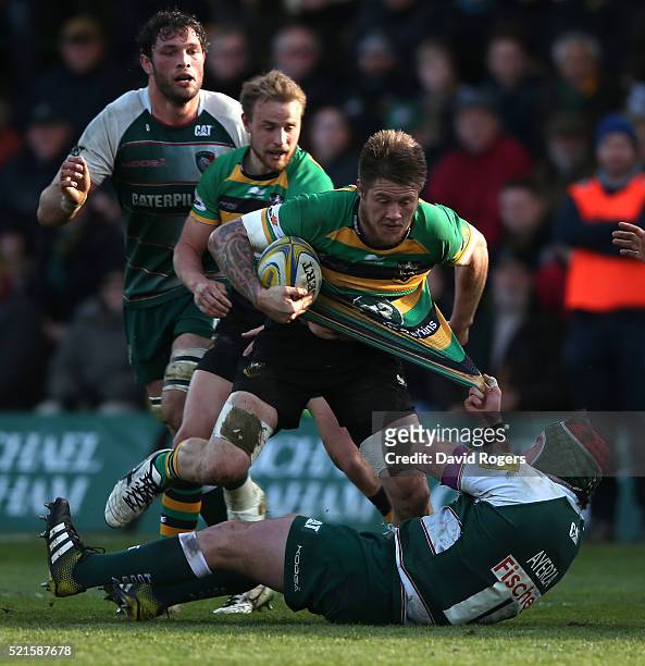 Teimana Harrison of Northampton is tackled by Marcos Ayerza during the Aviva Premiership match between Northampton Saints and Leicester Tigers at...