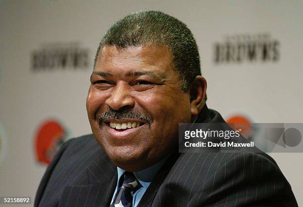 Romeo Crennel smiles as he is introduced as the new head coach of the Cleveland Browns during a press conference at the Cleveland Browns Training and...