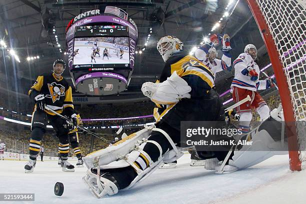 Jeff Zatkoff of the Pittsburgh Penguins looks back after being scored on by Keith Yandle of the New York Rangers in the second period in Game Two of...