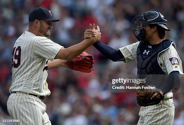 Danny Santana and John Ryan Murphy of the Minnesota Twins celebrate a win of the game against the Los Angeles Angels of Anaheim on April 16, 2016 at...