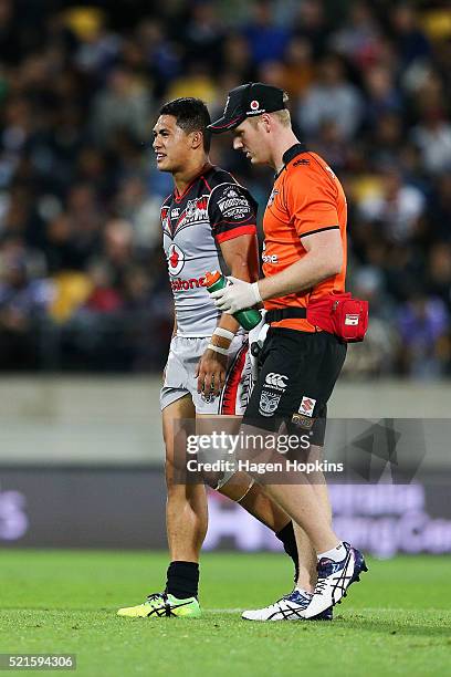 Roger Tuivasa-Sheck of the Warriors looks on after sustaining a knee injury during the round seven NRL match between the Canterbury Bulldogs and the...