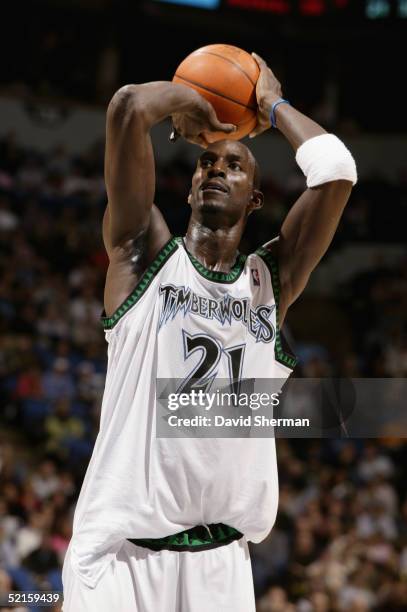 Kevin Garnett of the Minnesota Timberwolves shoots a free throw against the Detroit Pistons during the game at Target Center on January 24, 2005 in...