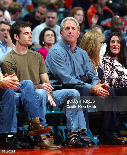John Fox, Head Coach of the NFL Charlotte Panthers and NASCAR driver Jeff Gordon watch the game between the San Antonio Spurs and Charlotte Bobcats...
