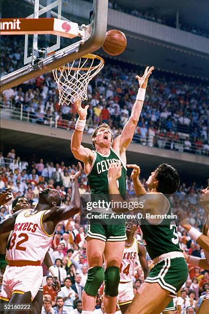 Bill Walton of the Boston Celtics goes up for a rebound against the Houston Rockets during an NBA game at the Summit in 1986 in Houston, Texas. NOTE...