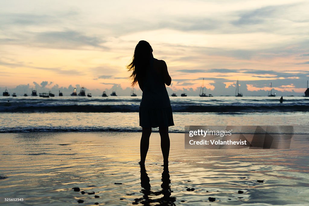 Woman on the beach at sunset, San Juan del Sur