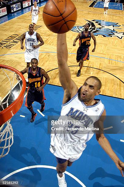 Grant Hill of the Orlando Magic dunks against the Golden State Warriors on February 8, 2005 at TD Waterhouse Centre in Orlando, Florida. The Warriors...