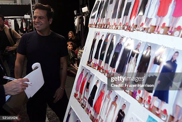 Designer Narciso Rodriguez is interviewed backstage at the Narciso Rodriguez Fall 2005 show during the Olympus Fashion Week at Bryant Park February...