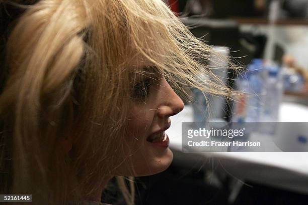 Model gets her hair done backstage at the Narciso Rodriguez Fall 2005 show during the Olympus Fashion Week at Bryant Park February 8, 2004 in New...