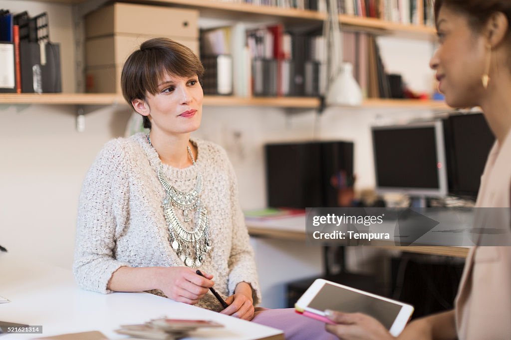 Business woman working in small  office, Barcelona.