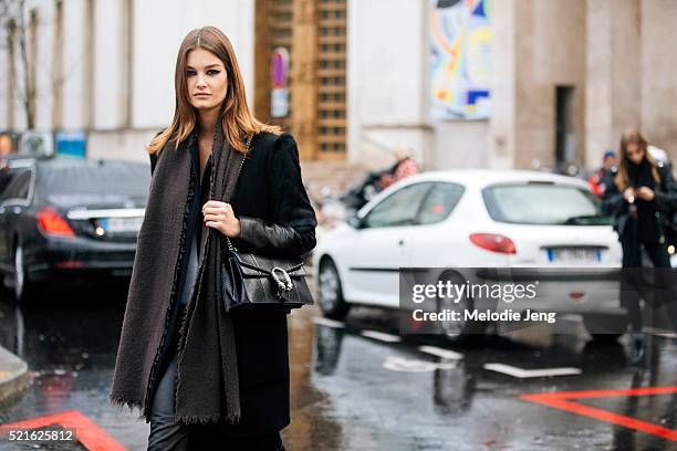 French model Ophelie Guillermand wears Barbara Bui, Alexander Wang, Helmut Lang, BLK DNM, Acne Studios, and a black Dionysus Gucci bag after the...