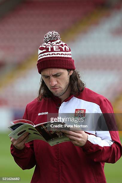John-Joe O'Toole of Northampton Town reads the matchday programme prior to the Sky Bet League Two match between Exeter City and Northampton Town at...