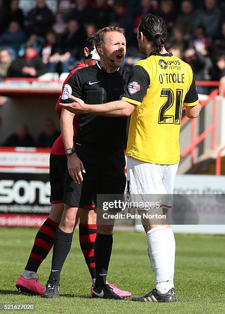 Referee Oliver Langford talks to John-Joe O'Toole of Northampton Town during the Sky Bet League Two match between Exeter City and Northampton Town at...