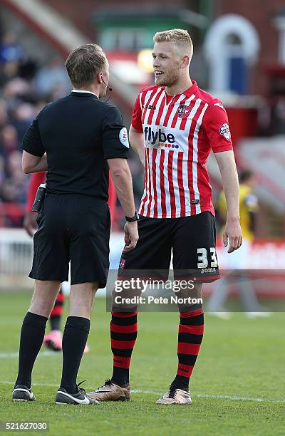 Referee Oliver Langford talks to Jayden Stockley of Exeter City during the Sky Bet League Two match between Exeter City and Northampton Town at St...