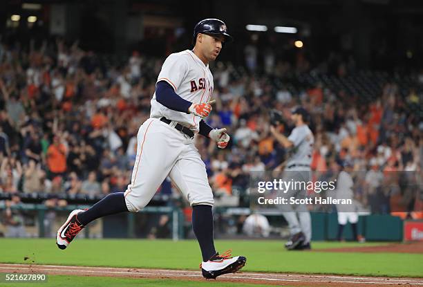 George Springer of the Houston Astros rounds the bases after he hit a two-run home run off Justin Verlander of the Detroit Tigers during the first...