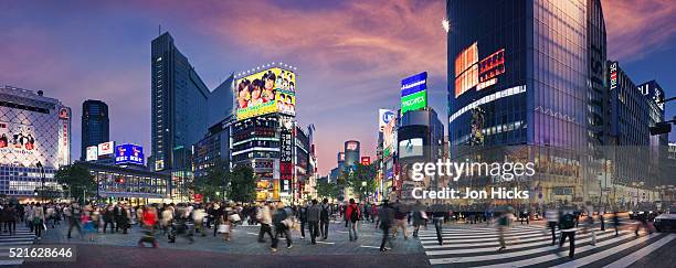 shibuya crossing at sunset. - shibuya stock pictures, royalty-free photos & images