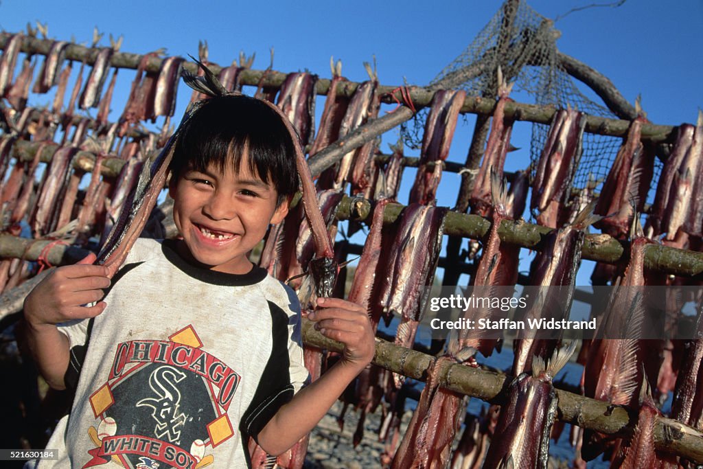 Inupiat Eskimo Boy with Drying Whitefish, Alaska