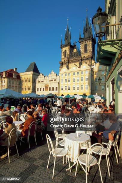 diners drinking at cafe in old town square - prague cafe stock pictures, royalty-free photos & images