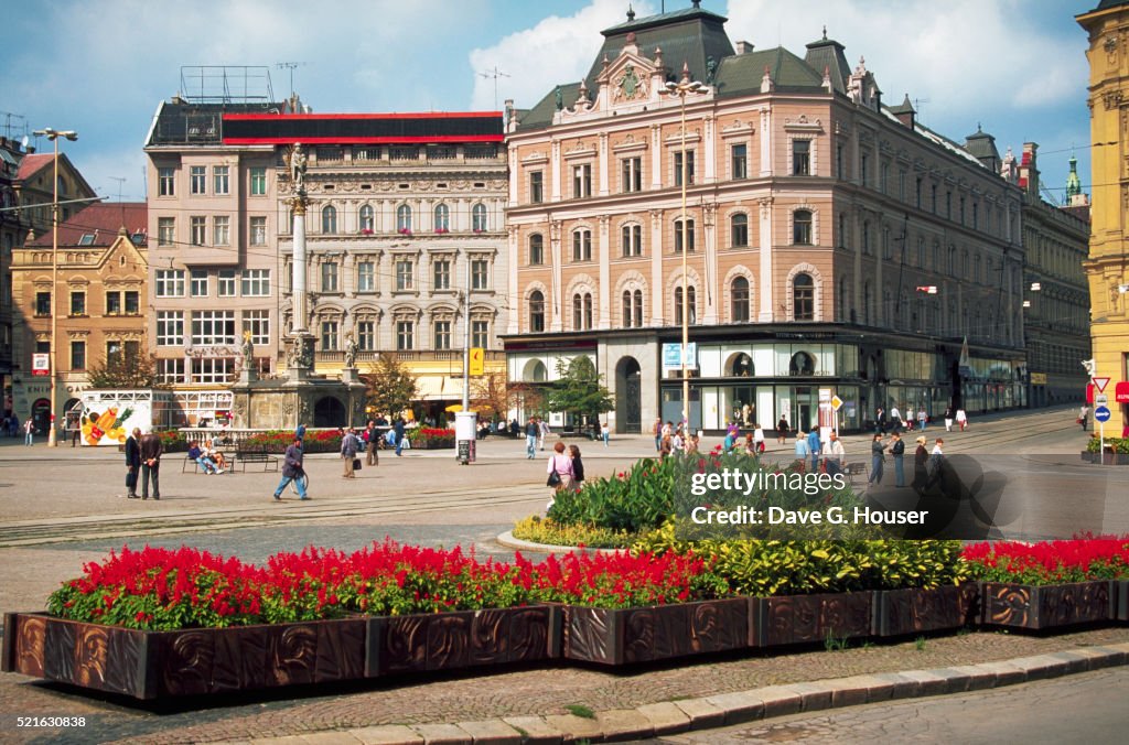 City Dwellers Walking in Brno's Main Square