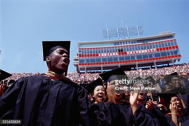 graduates at indiana university commencement - graduation crowd fotografías e imágenes de stock