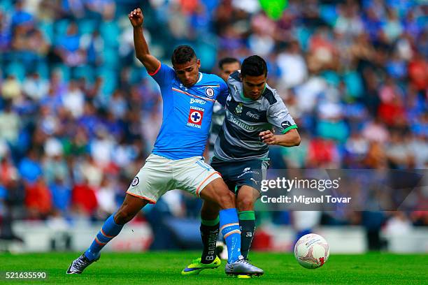 Joao Rojas of Cruz Azul fights for the ball with Ulises Davila of Santos during the 14th round match between Cruz Azul and Santos Laguna as part of...