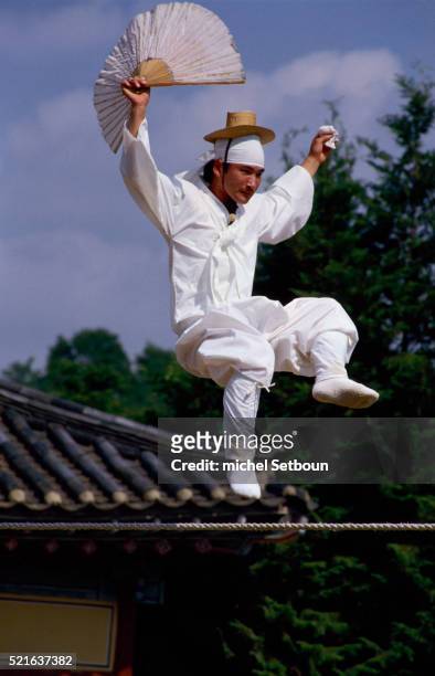 traditional korean tightrope walker jumping on tightrope - korea tradition stock pictures, royalty-free photos & images