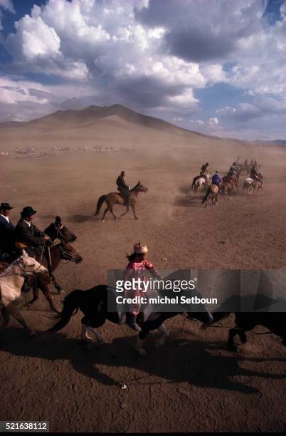 mongolian children and men riding horses - nadaam festival stock pictures, royalty-free photos & images