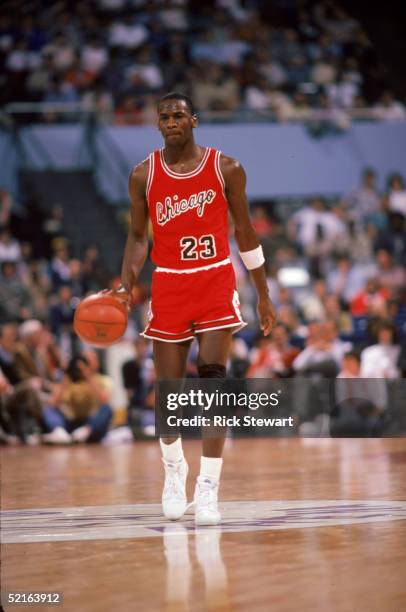 Michael Jordan of the Chicago Bulls brings the ball upcourt against the Los Angeles Clippers during a 1984-85 season game at the Sports Arena in Los...