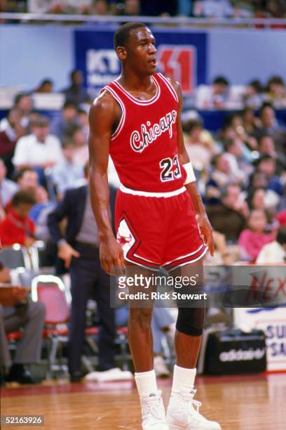 Michael Jordan of the Chicago Bulls stands on the court moves the ball at the parameter against the Los Angeles Clippers at the Sports Arena in Los...