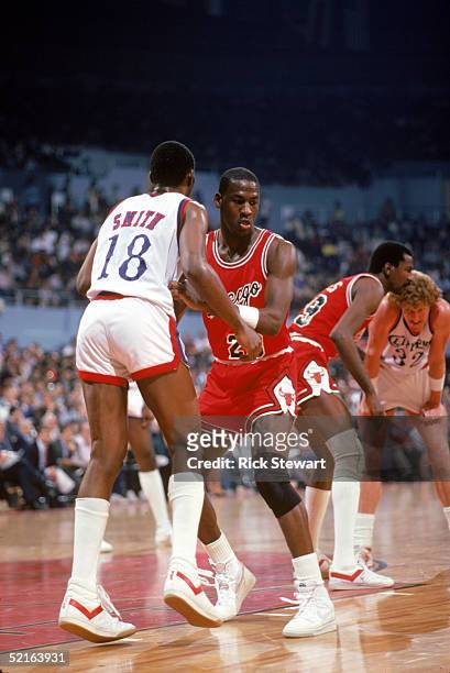 Michael Jordan of the Chicago Bulls defends Derek Smith of the Los Angeles Clippers during a December 1984 season game at the Sports Arena in Los...