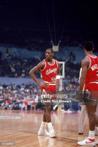 Michael Jordan of the Chicago Bulls stands on the court during a 1984 season game against the Los Angeles Clippers at the Sports Arena in Los...