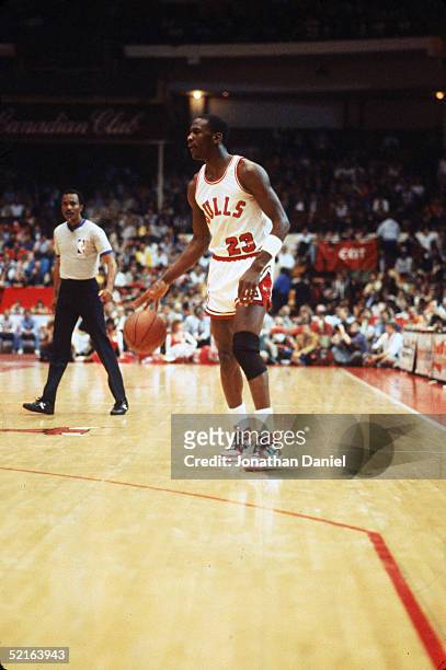 Michael Jordan of the Chicago Bulls moves the ball at the parameter during an Eastern Conference First Round Playoff game April 1985 game at the...