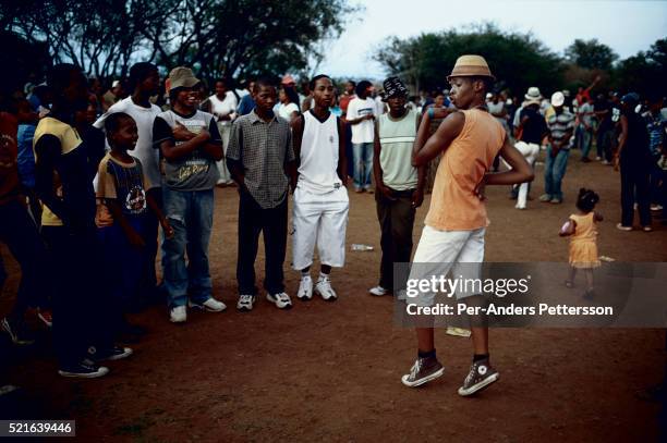 Youth dance to Kwaito music during a music festival on December in the Meadowlands section of Soweto, Johannesburg, South Africa. Kwaito was born in...