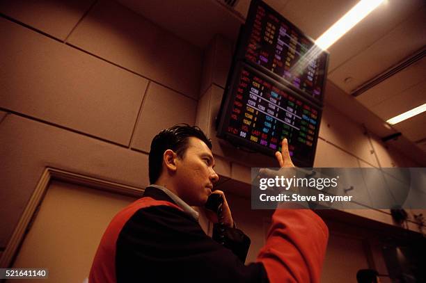 stock trader on exchange trading floor - vintage stock exchange stock pictures, royalty-free photos & images