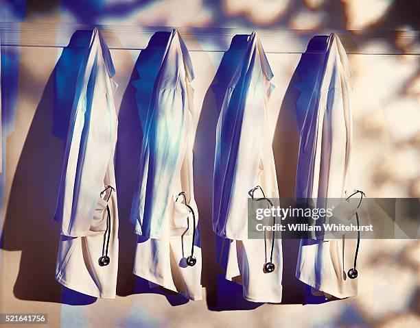 lab coats - clean suit stock pictures, royalty-free photos & images