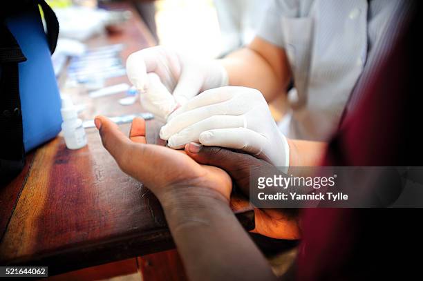 hiv quick test in a private orphanage in natitingou, benin - hiv test stock pictures, royalty-free photos & images