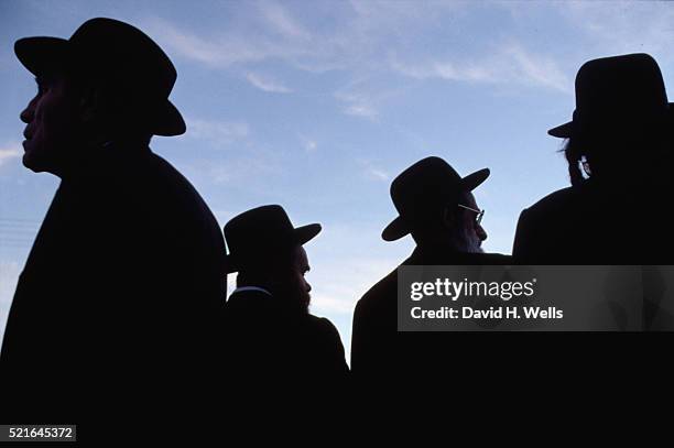 silhouettes of orthodox jews in jerusalem - orthodox judaism stock pictures, royalty-free photos & images