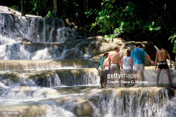 crossing dunn's river falls - dunns river falls stock pictures, royalty-free photos & images