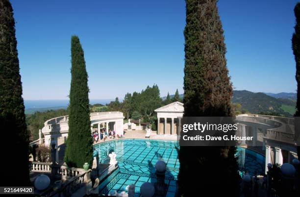 visitors view neptune bath at hearst castle - hearst castle stock pictures, royalty-free photos & images