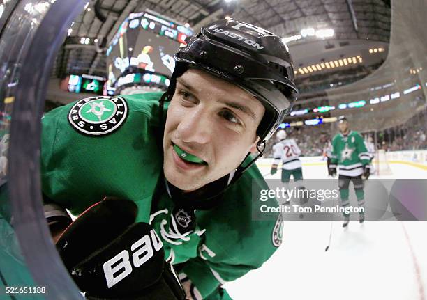 Jamie Benn of the Dallas Stars reacts after being checked into the boards by the Minnesota Wild in the first period in Game Two of the Western...