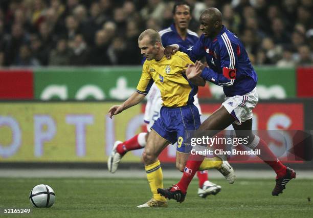 Fredrik Ljungberg of Sweden in action with Patrick Vieira of France during the international friendly match between France and Sweden at Stade De...