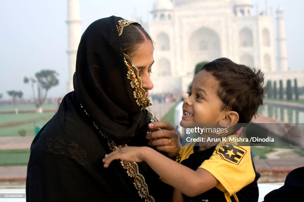 Muslim Mother Child in front of Taj Mahal Agra Uttar Pradesh