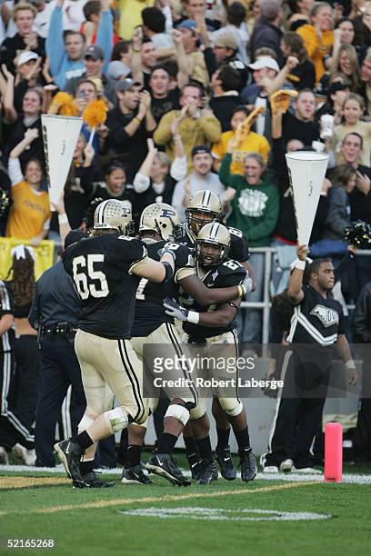 Running back Brandon Jones of the Purdue University Boilermakers celebrates with teammates after scoring a touchdown in the second half of the game...