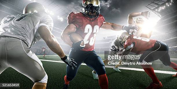 american football in action - tackling stockfoto's en -beelden
