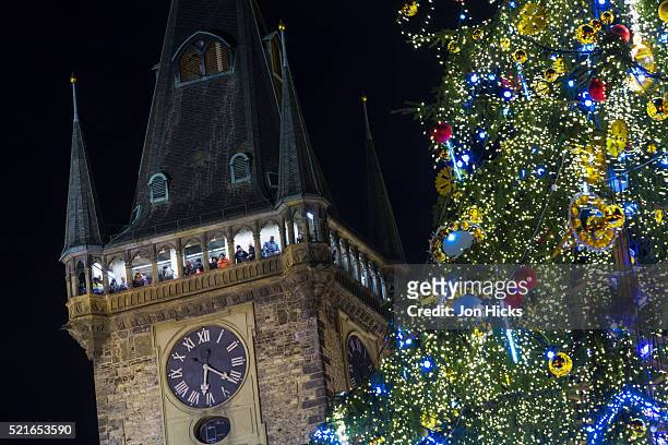 prague old town hall tower and christmas tree. - prague christmas market old town stock-fotos und bilder