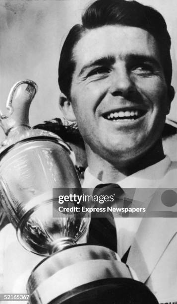 South African professional golfer Gary Player holds his trophy for winning the British Open, Muirfield, Scotland, 1959.