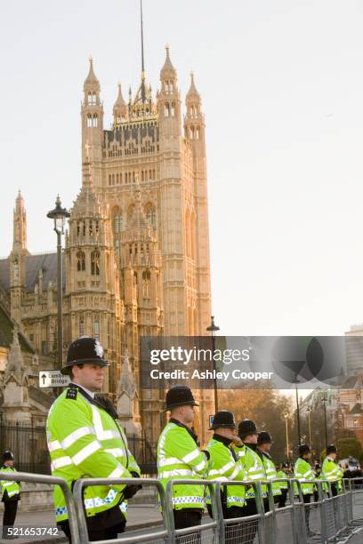 police guard during protest at parliament square - barricade stock pictures, royalty-free photos & images
